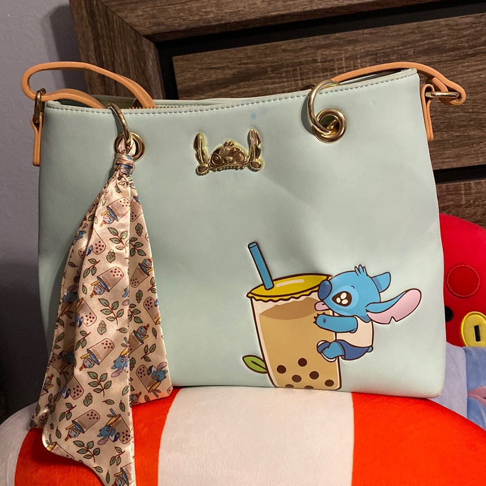 Boba Stitch Crossbody! Has small dents back and front .